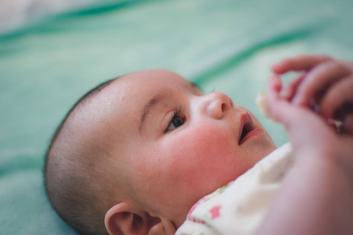 A child looking at her or his hands