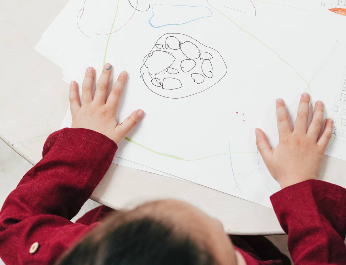 A child drawing bubbles