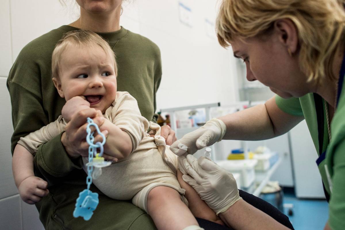 Baby receiving a vaccination.