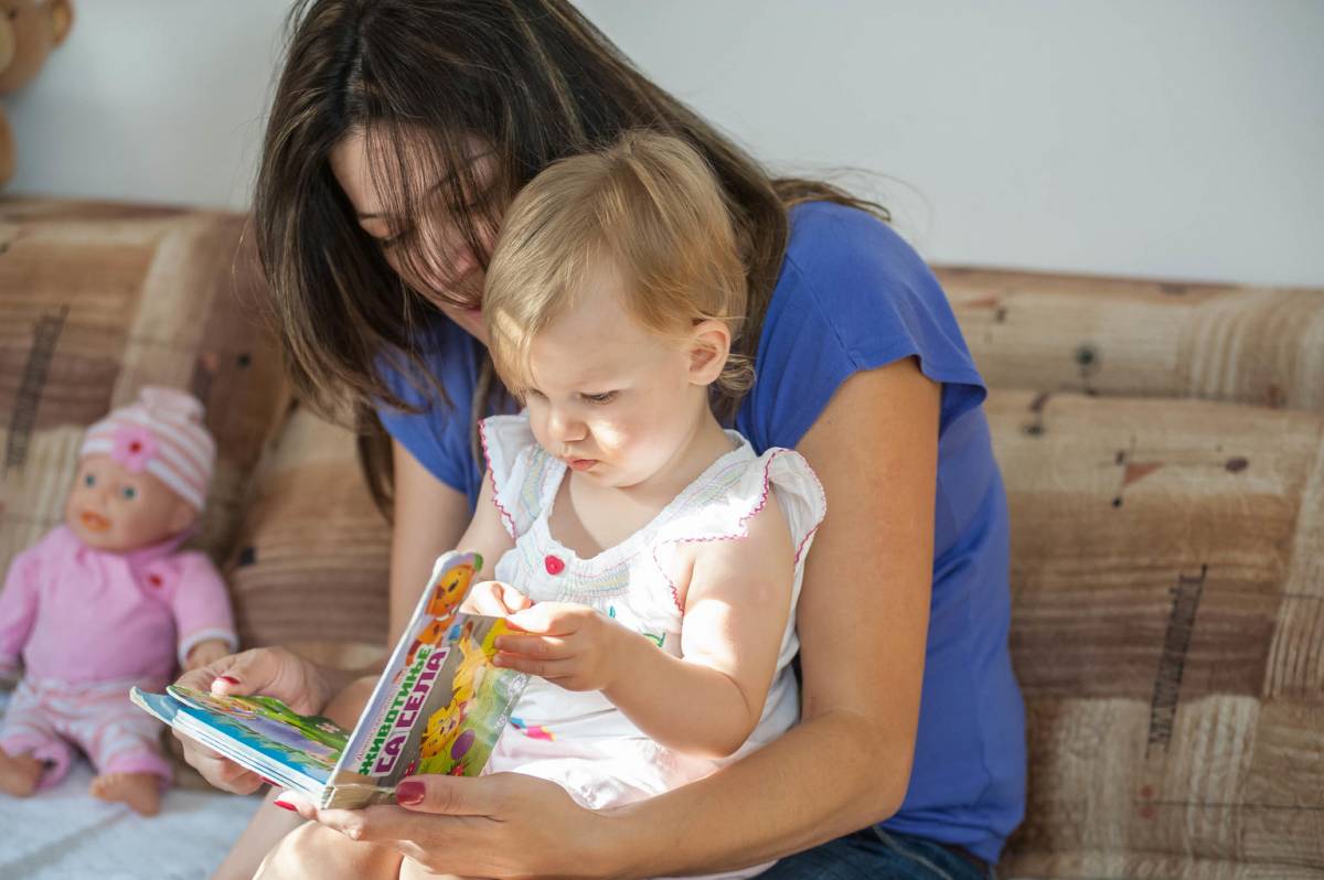 Mother reading with her baby.