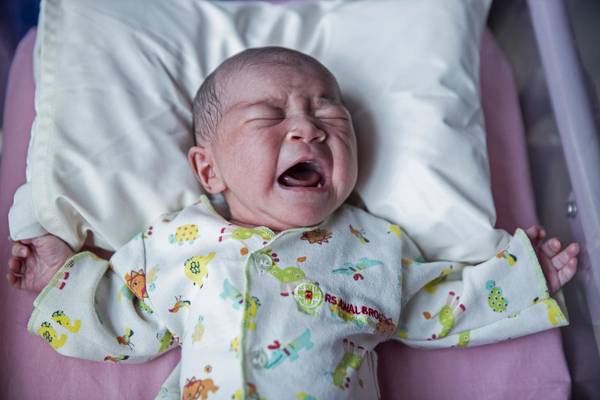 Baby crying in his crib.