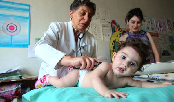 Mother, child and doctor. General check-up, growth monitoring and immunisation for babies and children.