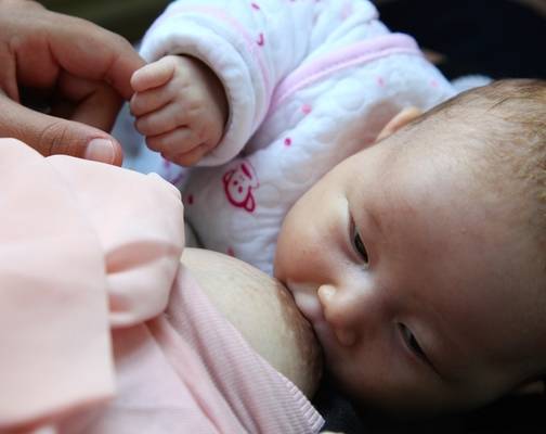 Mother breastfeeding her baby.