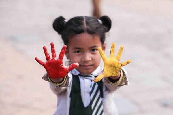 Girl participating in a museum activity.