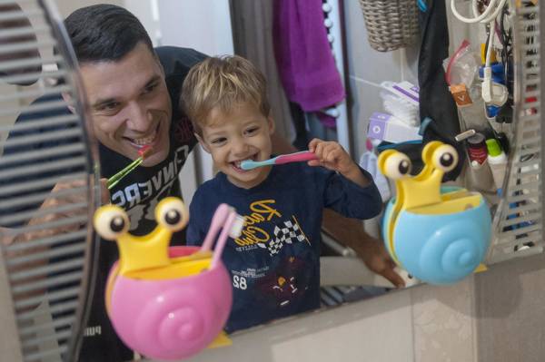 Father plays with his son Kolja (2 years) in their home in Belgrade, Serbia.