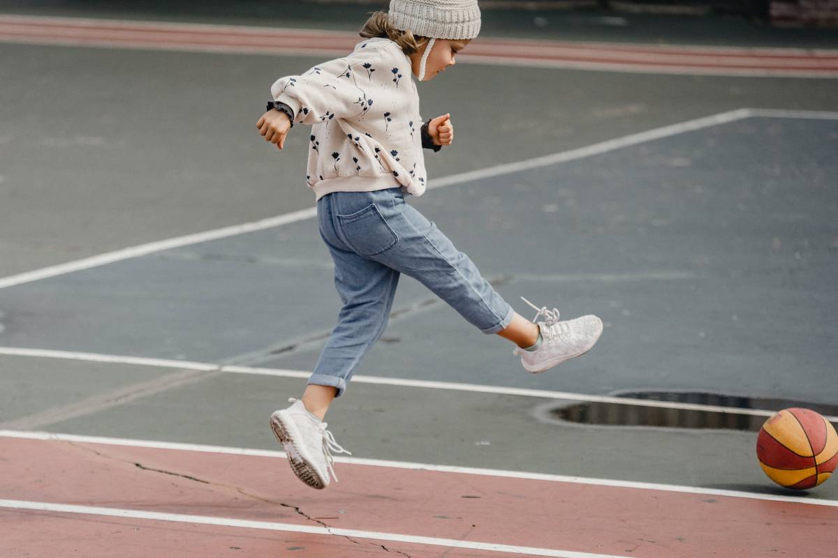 A girl kicking the ball