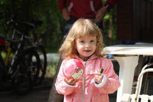A girl carrying a ball