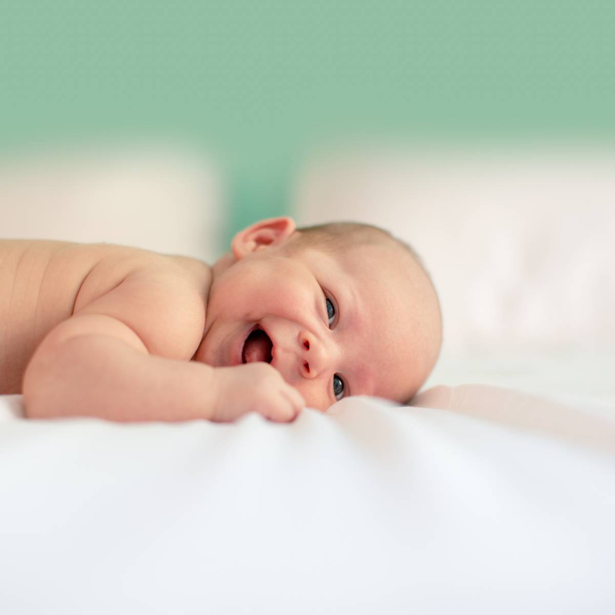 baby at home smile on belly