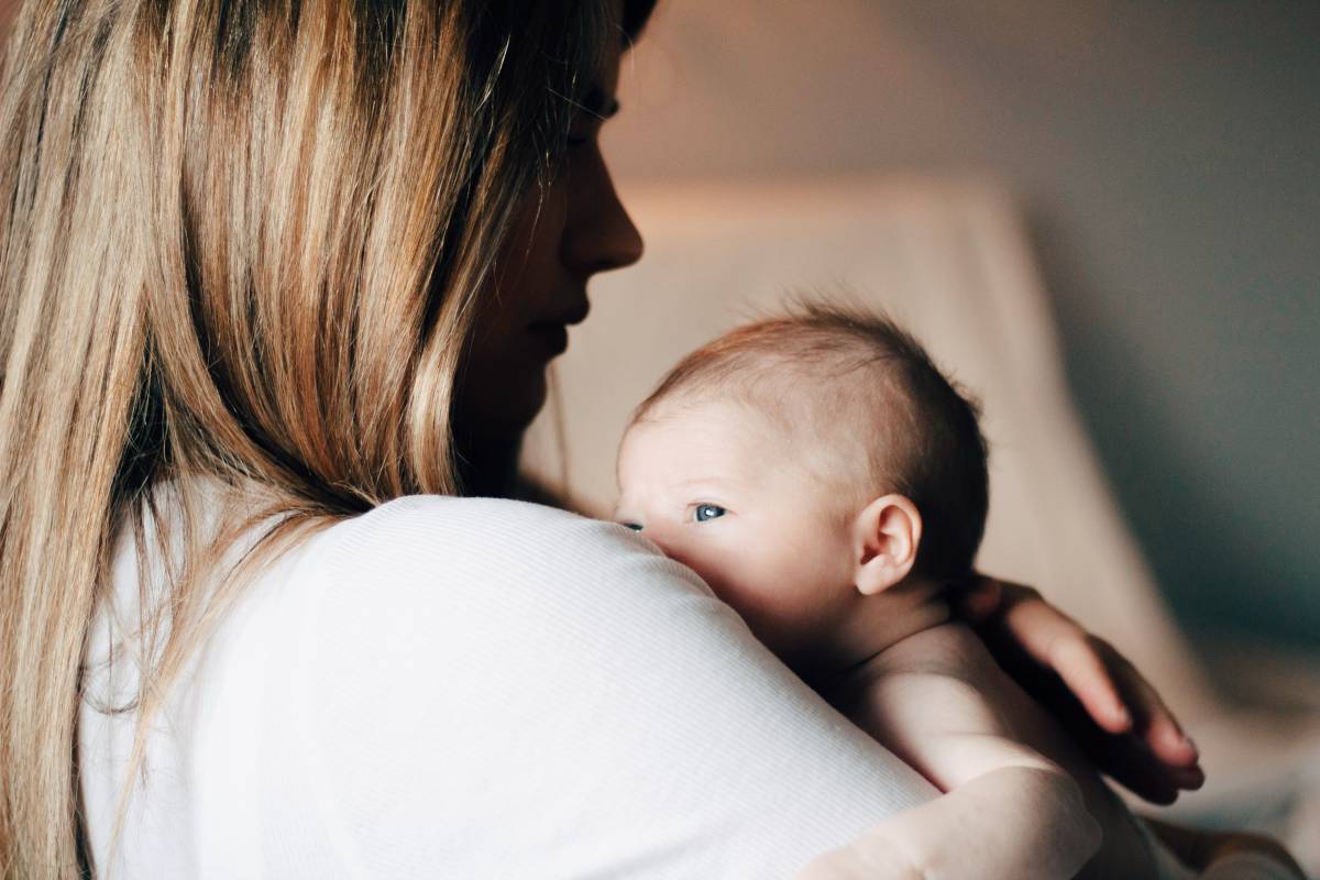 Mother with baby in arms