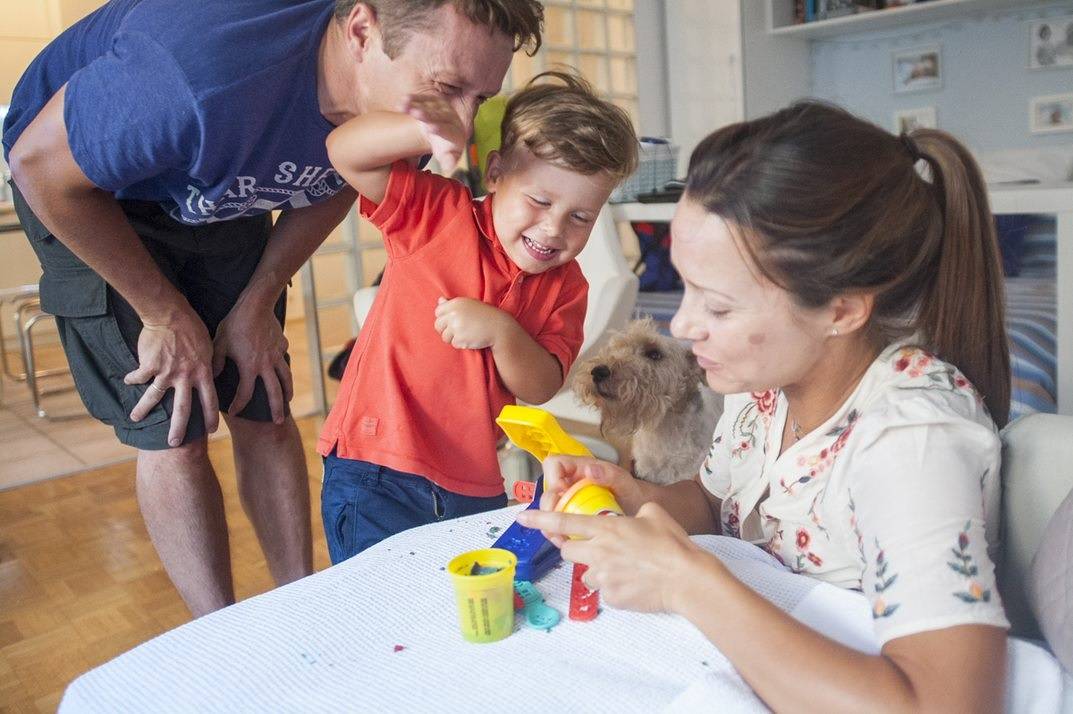 Adults playing with the child