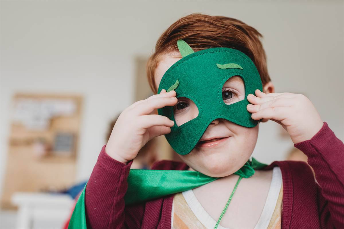 Boy playing costumes.
