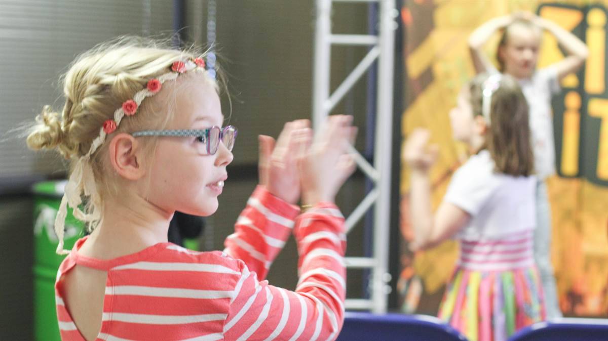 Kids playing in a theater