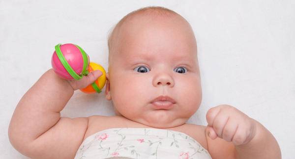 A child holding his or her rattle