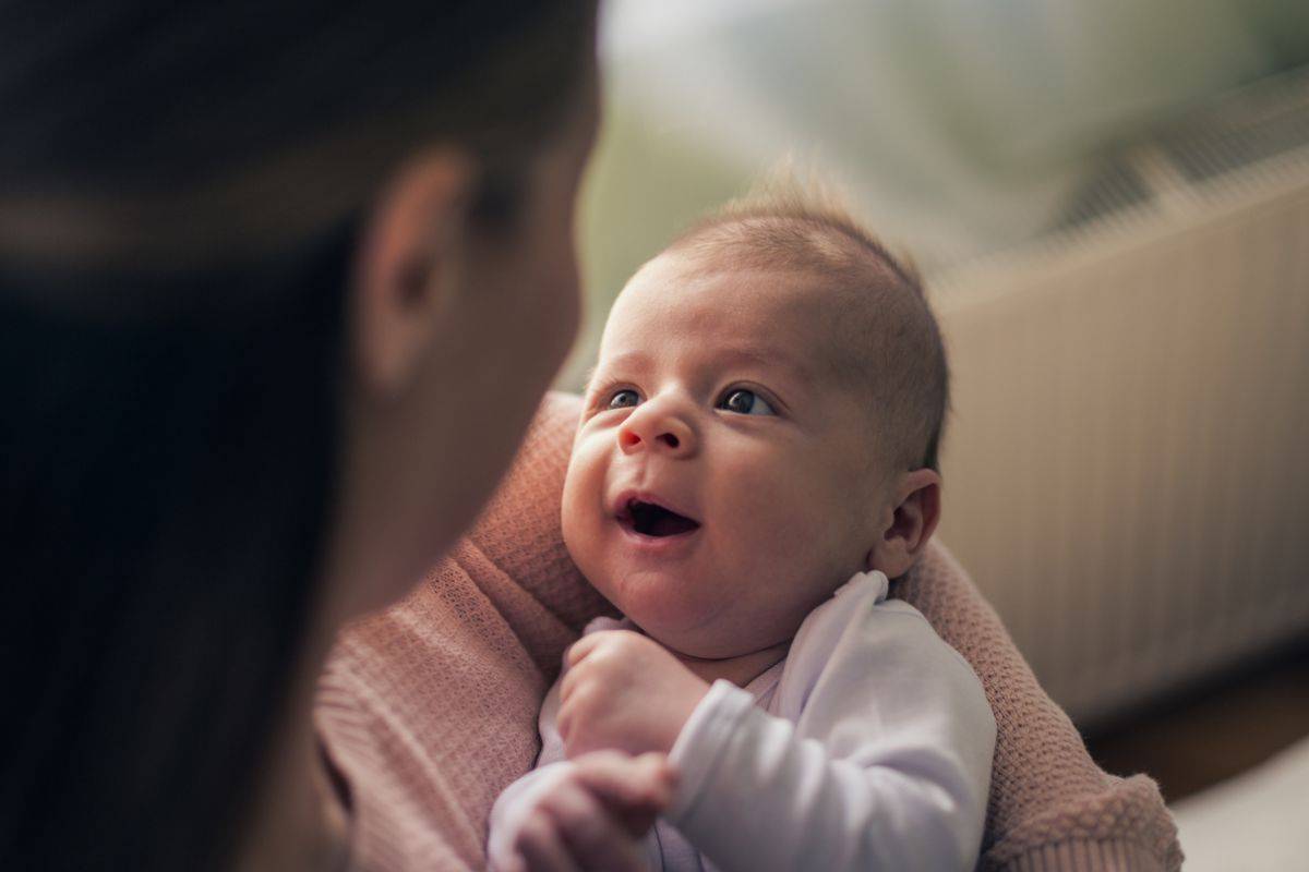 A mother and her child are happily looking at each other