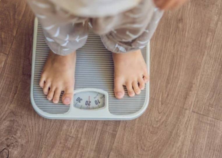 A child on a weight scale