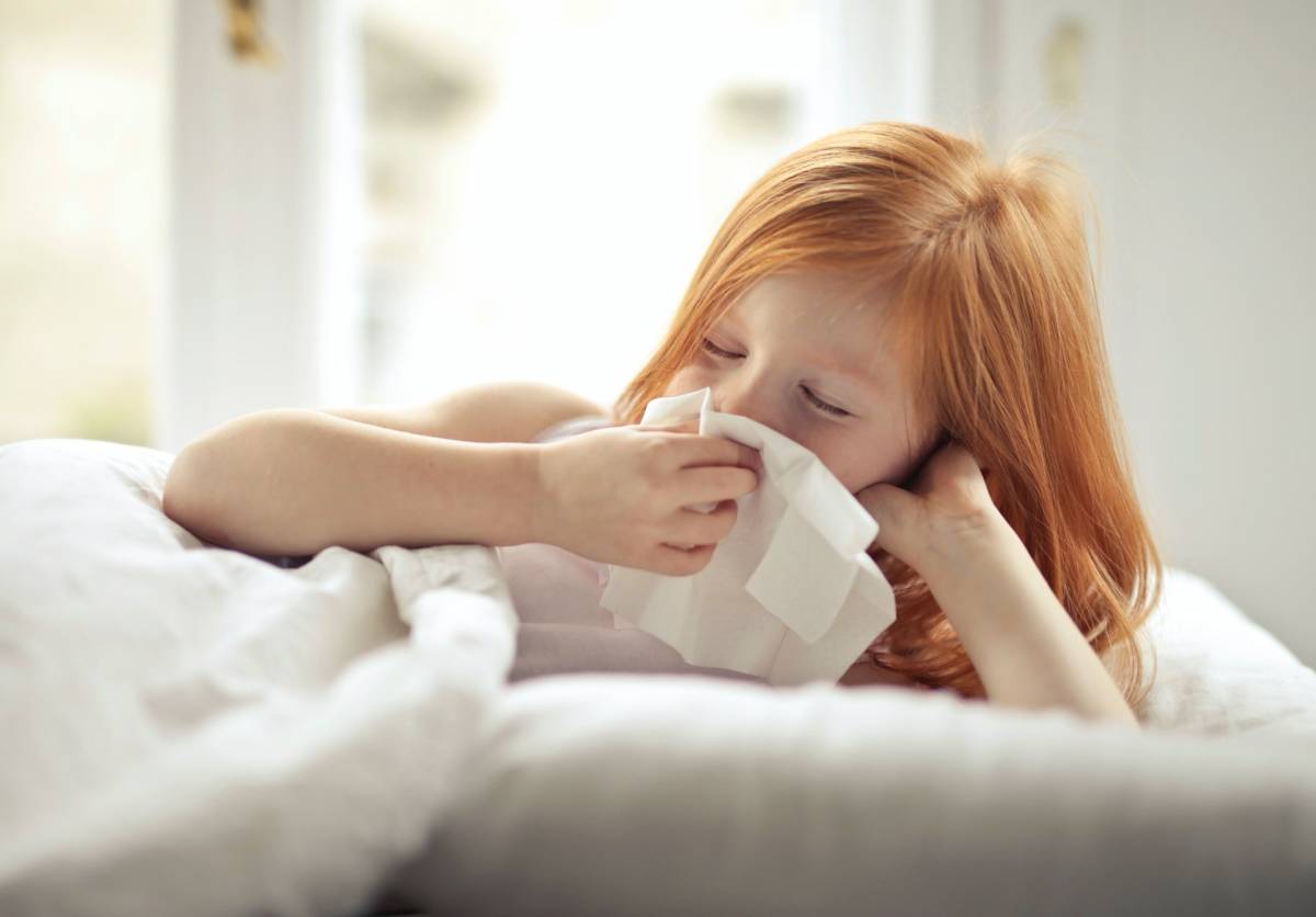 A child blowing nose