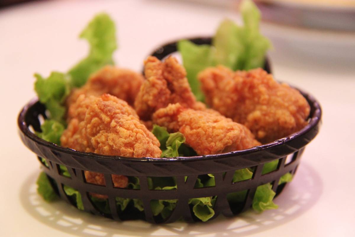 fried crispy chicken fingers in a basket 