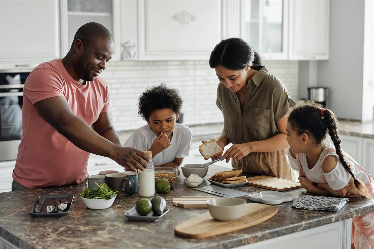 Family making breakfast in the kitchen 