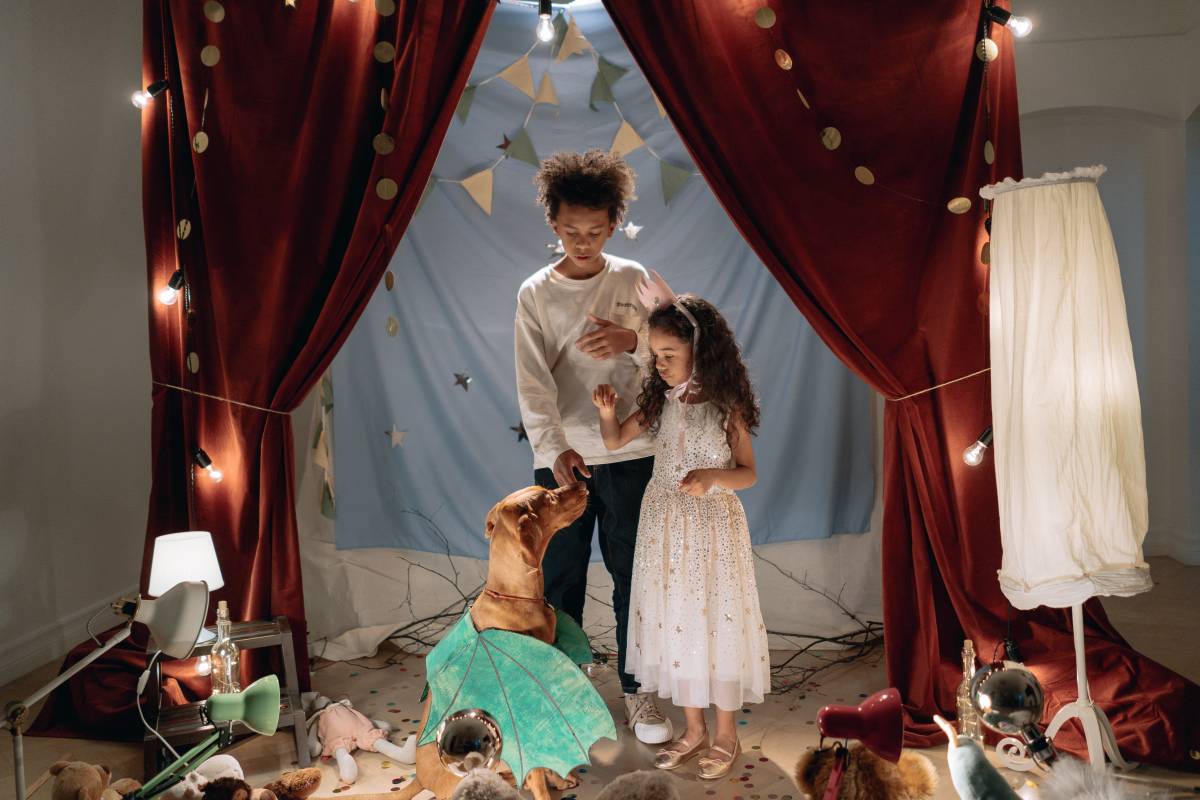 Boy, girl and dog performing a home-theater