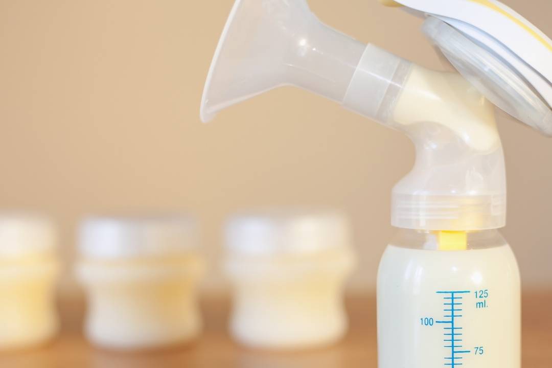 Expressing breast milk with a device