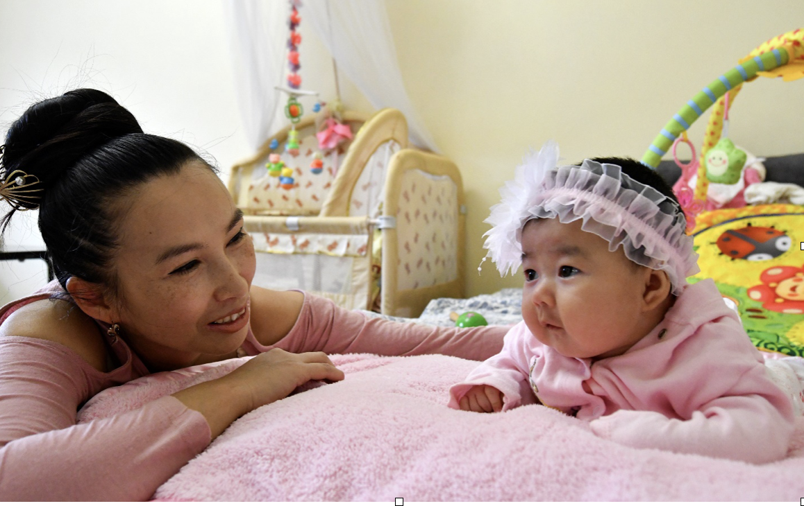 Baby (1 y.o) at home playing