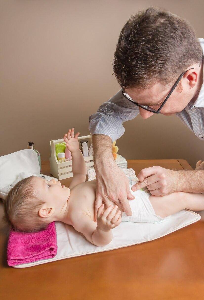 Father changing diaper