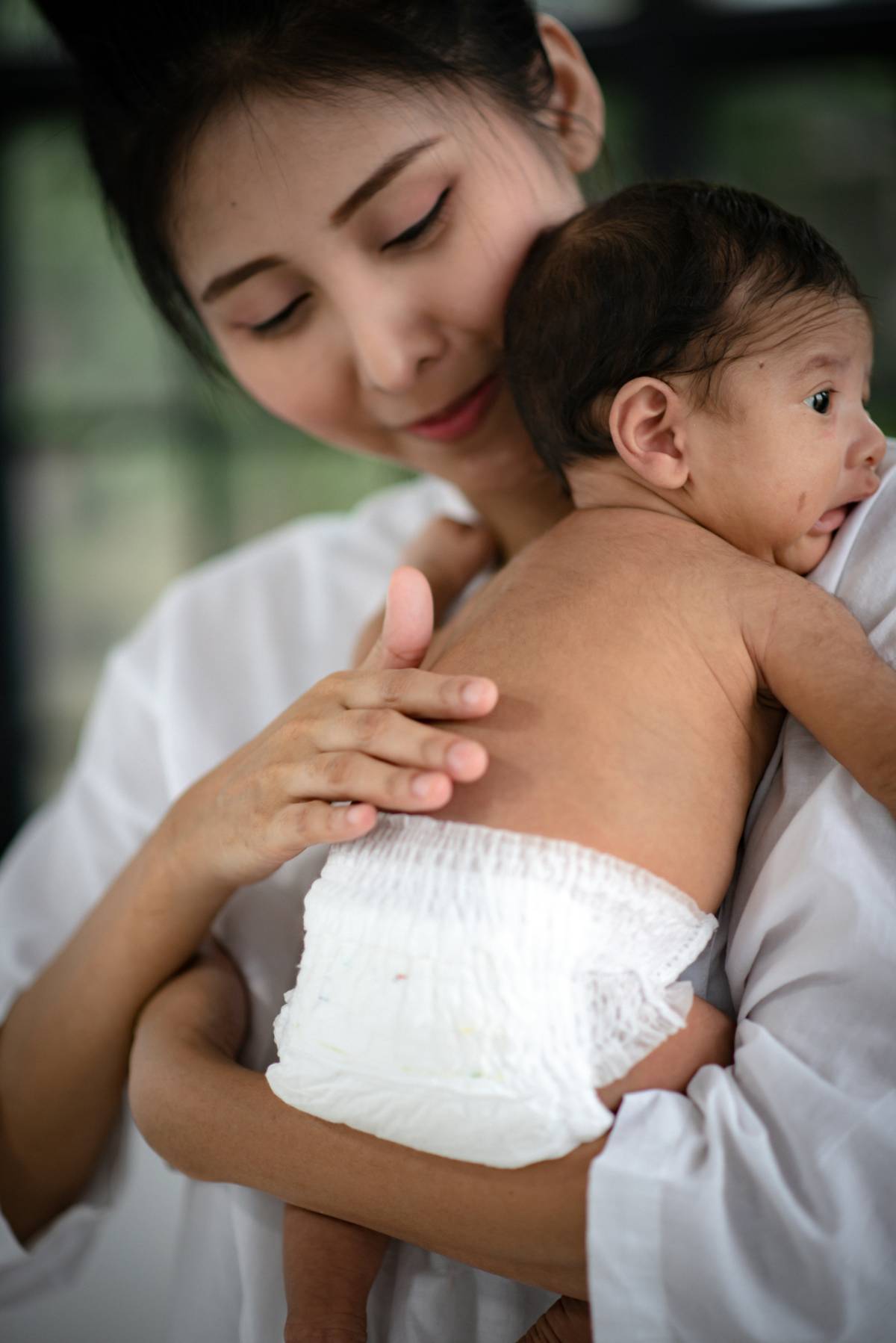 Mother holding young baby