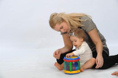 A mother playing with her child