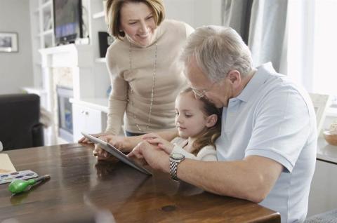 Grandparents doing a videocall with their granddaughter