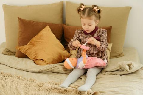 A girl playing with toys