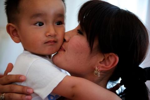 Portrait of a young mother with one of her children