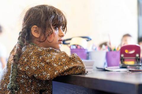 Girl in her classroom.