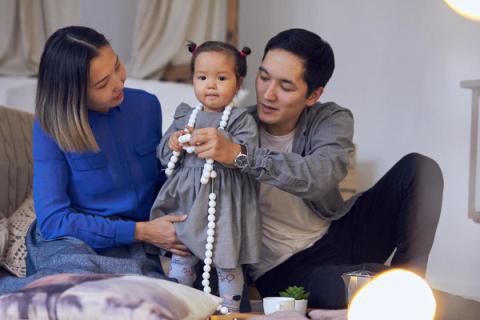 Family interacting with the baby girl.