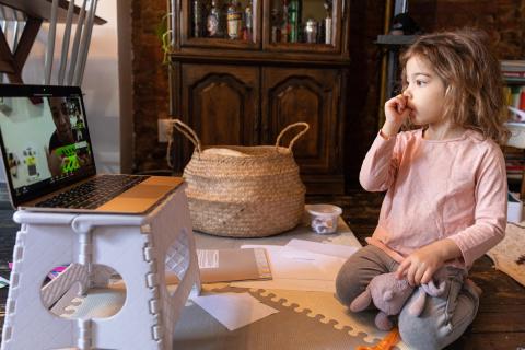 Girl spending screen time in her house.