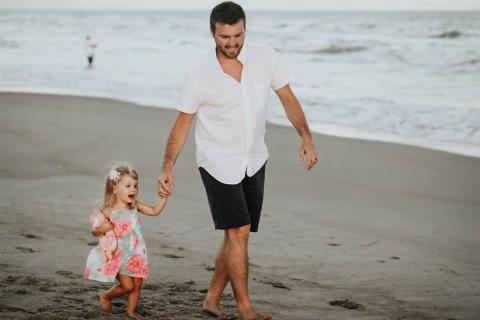 Father with daughter holding hands
