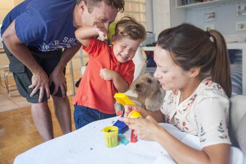 Adults playing with the child
