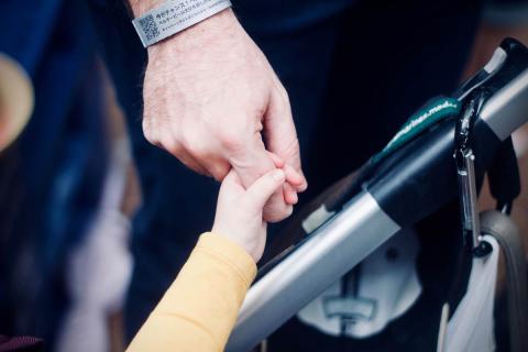 Father with daughter holding hands
