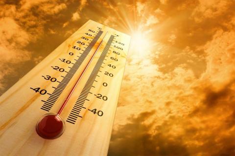 A thermometer showing a high outside air temperature