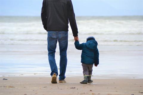 Father with son holding hands