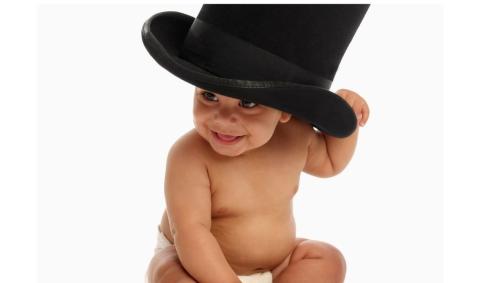 A child wearing a big black hat