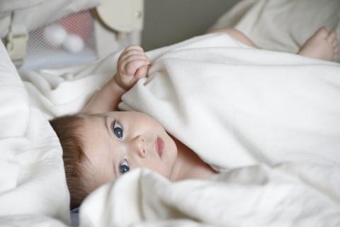 A baby turning her/his head towards the sound