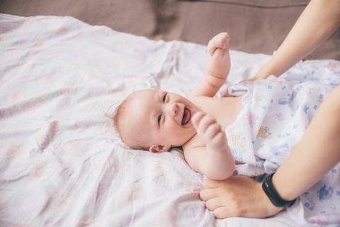 A baby rolling on her/his back