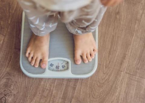 A child on a weight scale