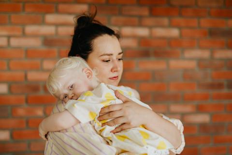 A mother with a scared child 