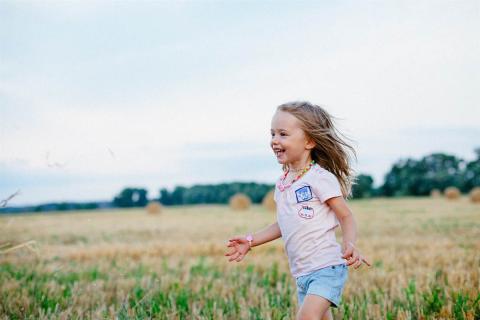 A girl running outside