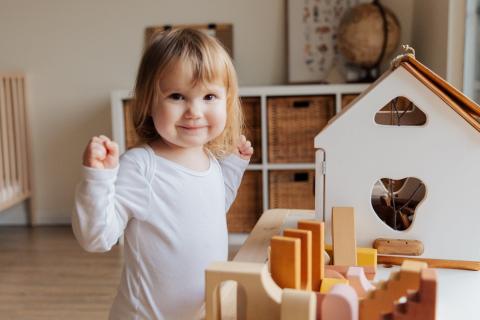 A happy child with toys