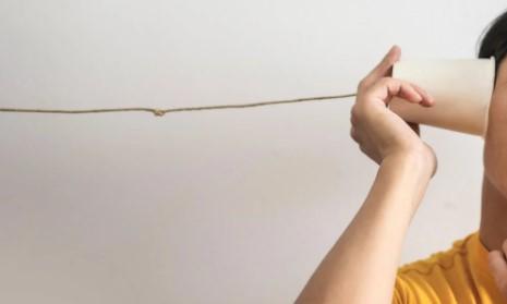 someone holding a string phone