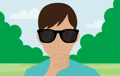 cartoon boy wearing glasses and holding finger against his lips