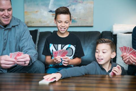 family playing a card game