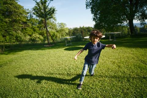 boy running through garden